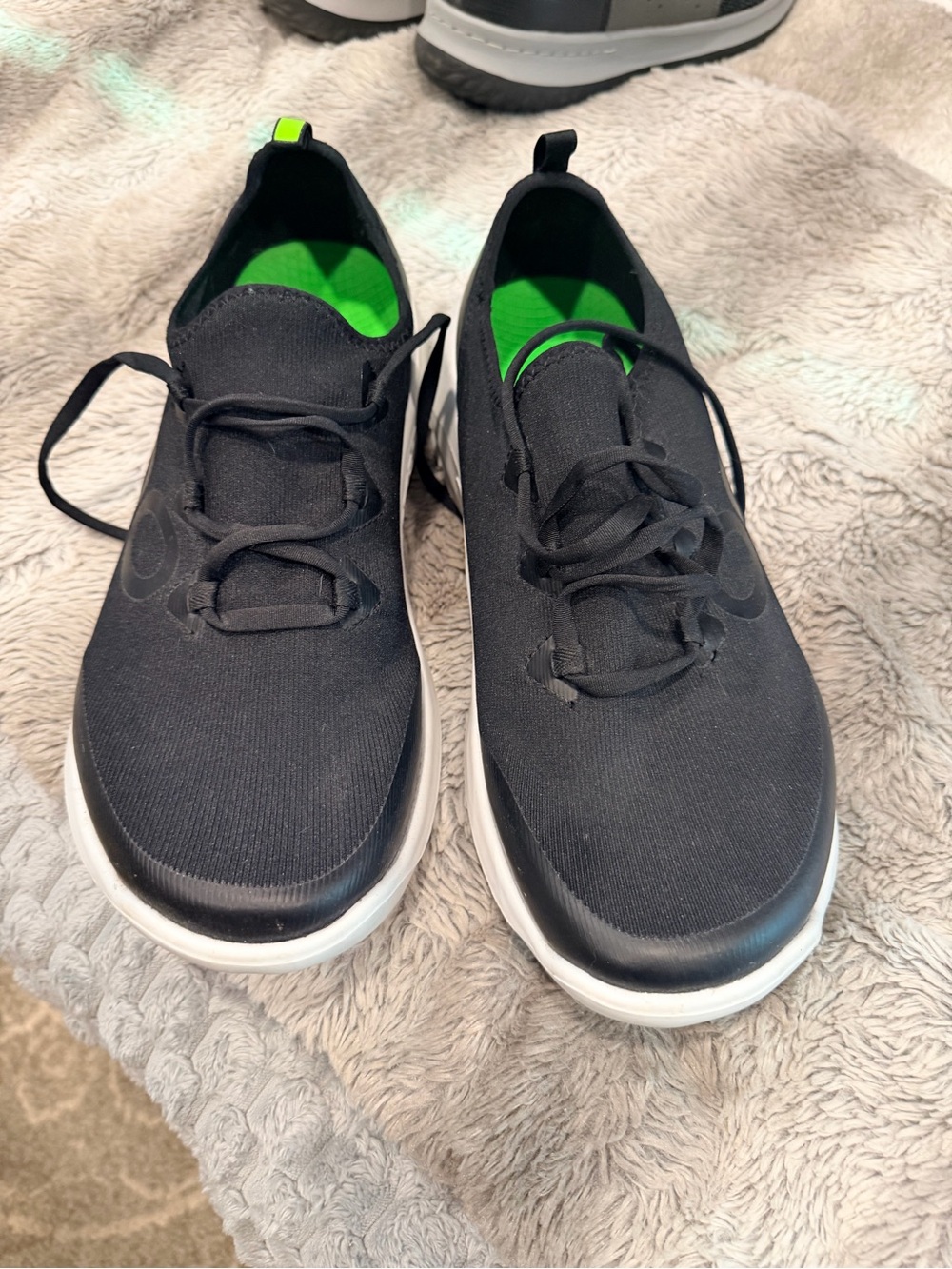 OOFOS Black Slip-On Sneakers with Bright Green Insole and White Midsole